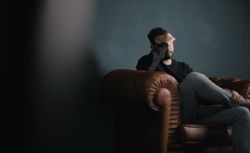 nik-shuliahin-251237-unsplash man arm chair thinking
